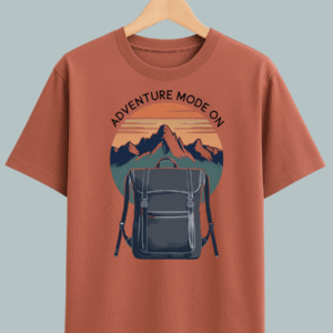 Oversized travel T-shirt with ‘Adventure Mode On’ graphic featuring backpack design, perfect for explorers and streetwear fashion.