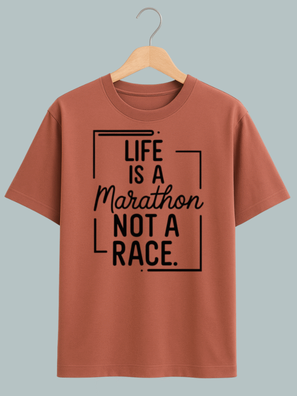 Oversized T-shirt with ‘Life Is a Marathon Not a Race’ motivational quote in bold typography.