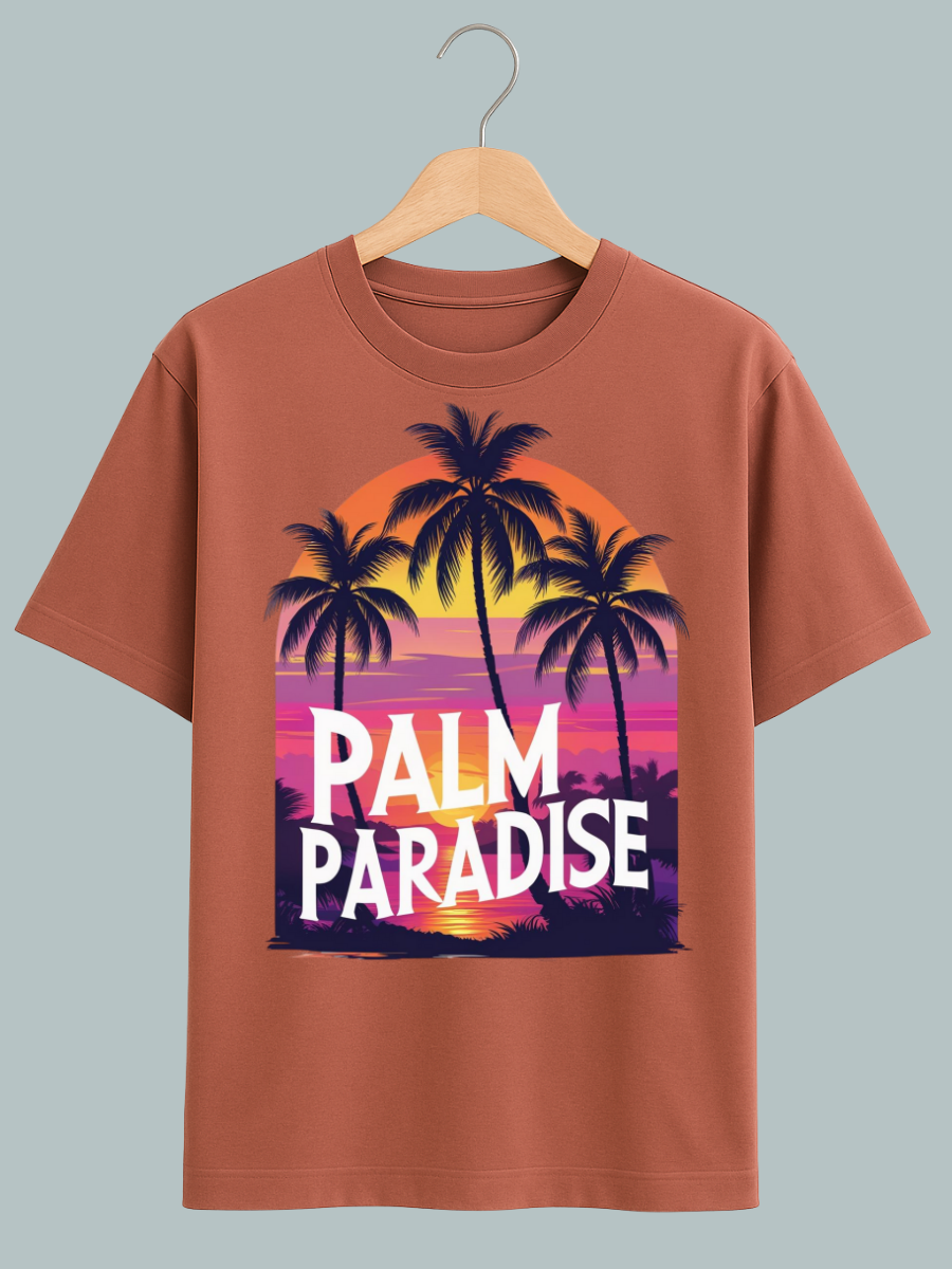 Oversized beach vibes T-shirt with ‘Welcome to Paradise’ graphic featuring sunset, sea, and palm trees for tropical streetwear fashion.